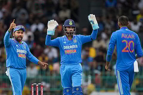 Axar Patel celebrates with Rohit Sharma and KL Rahul after taking the wicket of Janith Liyanage
